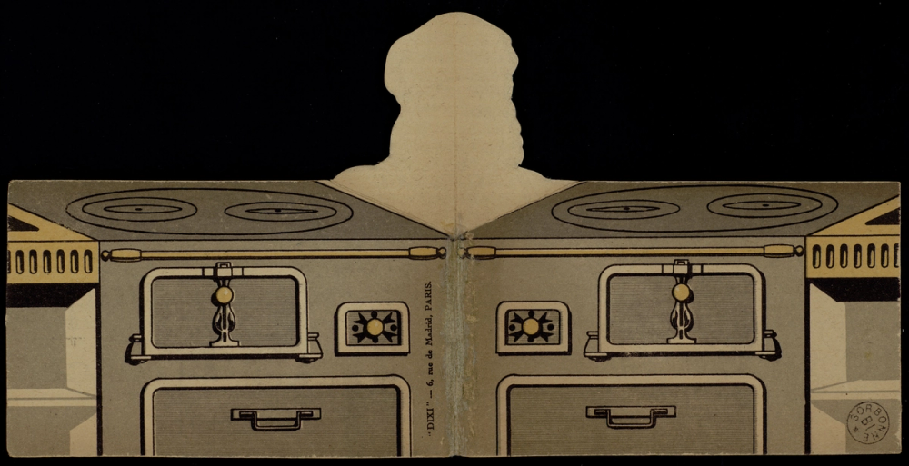 Carte Utilisez les Restes fermée, vue du dos : représentation d'une cuisinière à bois avec plaque de cuisson et fours, silhouette découpée de la tête du cuisinier dépassant en pop-up au centre, pliure centrale visible.