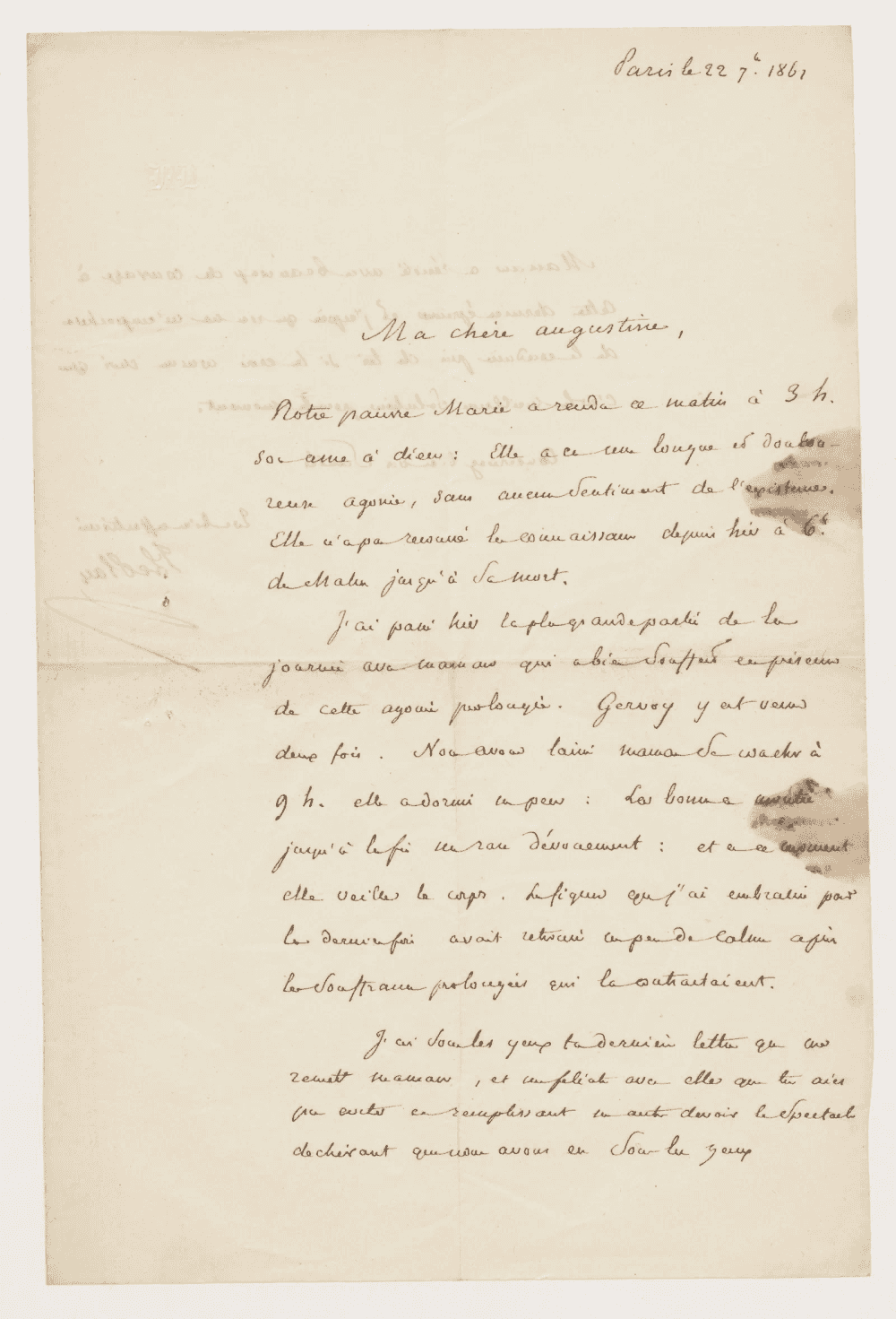 Première page d’une lettre manuscrite datée de Paris et adressée à Augustine, encre brune sur papier taché, marqué par la transparence du verso.