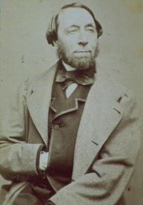 Old photograph of a bearded man dressed in mid-19th-century fashion.
